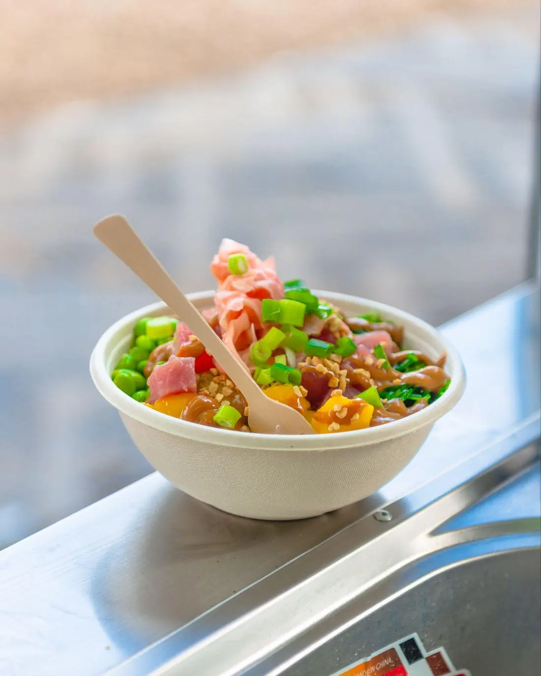 Freshly prepared Peeld poke bowl in a takeaway bowl
